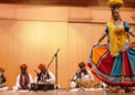 An artist of Rajasthani Cultural Group dancing on sharp edges of swords with seven pots on her head at Canberra on 06 No